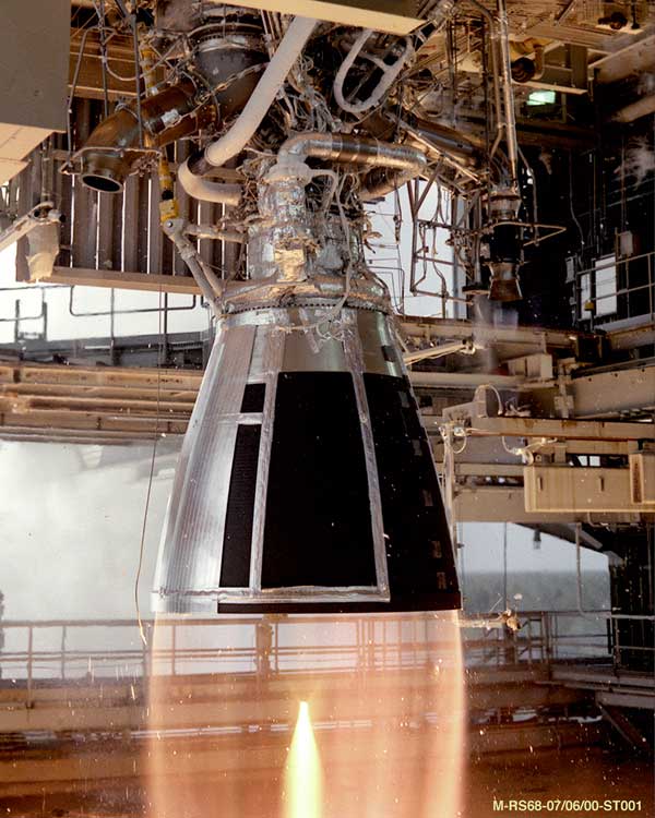 Image NASA. (2000, January). RS-68 being tested at NASA's Stennis Space Center. Retrieved from https://www.nasa.gov/images/content/148709main_d4_testing_08.jpg Photograph of a rocket engine in operation, with a converging plume of hot gas streaming out from the nozzle